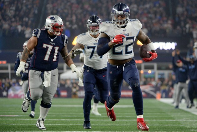 FOXBOROUGH, MASSACHUSETTS - JANUARY 04: Derrick Henry #22 of the Tennessee Titans carries the ball against Danny Shelton #71 of the New England Patriots in the second quarter of the AFC Wild Card Playoff game at Gillette Stadium on January 04, 2020 in Foxborough, Massachusetts. (Photo by Kathryn Riley/Getty Images)
