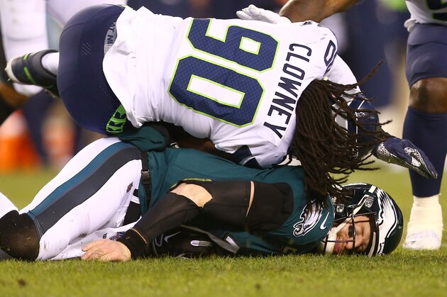 PHILADELPHIA, PENNSYLVANIA - JANUARY 05: Quarterback Carson Wentz #11 of the Philadelphia Eagles is hit by Jadeveon Clowney #90 of the Seattle Seahawks during the NFC Wild Card Playoff game at Lincoln Financial Field on January 05, 2020 in Philadelphia, Pennsylvania. (Photo by Mitchell Leff/Getty Images)