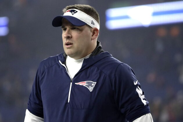 New England Patriots offensive coordinator Josh McDaniels watches his team warm up before an NFL wild-card playoff football game against the Tennessee Titans, Saturday, Jan. 4, 2020, in Foxborough, Mass. (AP Photo/Elise Amendola)