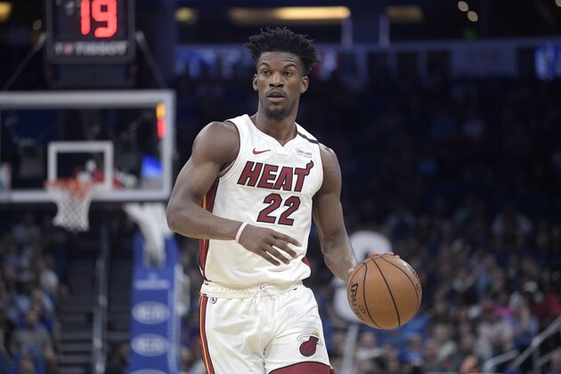 Miami Heat forward Jimmy Butler (22) sets up a play during the first half of an NBA basketball game against the Orlando Magic Friday, Jan. 3, 2020, in Orlando, Fla. (AP Photo/Phelan M. Ebenhack)