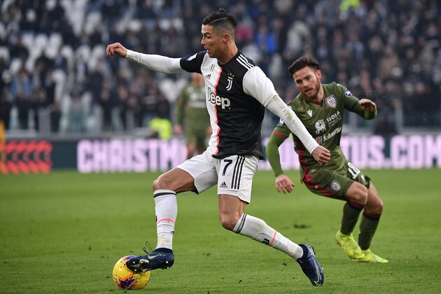 Juventus' Portuguese forward Cristiano Ronaldo outruns Cagliari's Uruguayan midfielder Nahitan Nandez (R) during the Italian Serie A football match Juventus vs Cagliari on January 6, 2020 at the Juventus Allianz stadium in Turin. (Photo by Marco Bertorello / AFP) (Photo by MARCO BERTORELLO/AFP via Getty Images) Juventus' Portuguese forward Cristiano Ronaldo outruns Cagliari's Uruguayan midfielder Nahitan Nandez (R) during the Italian Serie A football match Juventus vs Cagliari on January 6, 2020 at the Juventus Allianz stadium in Turin. (Photo by Marco Bertorello / AFP) (Photo by MARCO BERTORELLO/AFP via Getty Images)
