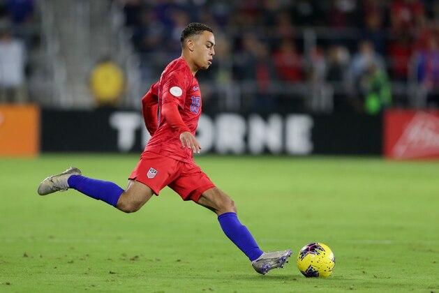 ORLANDO, FL - NOVEMBER 15: Sergino Dest #18 of the United States sends a ball downfield during a game between Canada and USMNT at Exploria Stadium on November 15, 2019 in Orlando, Florida. (Photo by John Dorton/ISI Photos/Getty Images)