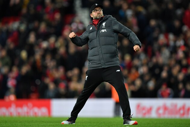 Liverpool's German manager Jurgen Klopp celebrates on the pitch after the English FA Cup third round football match between Liverpool and Everton at Anfield in Liverpool, north west England on January 5, 2020. - Liverpool won the game 1-0. (Photo by Paul ELLIS / AFP) / RESTRICTED TO EDITORIAL USE. No use with unauthorized audio, video, data, fixture lists, club/league logos or 'live' services. Online in-match use limited to 120 images. An additional 40 images may be used in extra time. No video emulation. Social media in-match use limited to 120 images. An additional 40 images may be used in extra time. No use in betting publications, games or single club/league/player publications. /  (Photo by PAUL ELLIS/AFP via Getty Images)
