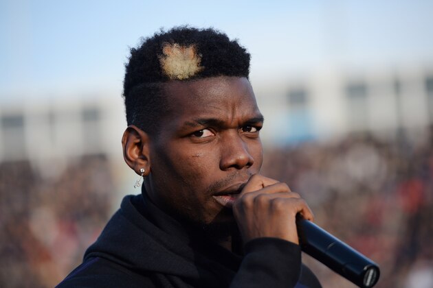 Manchester United and France midfielder Paul Pogba speaks prior to a gala football match between All Star France and Guinea at the Vallee du Cher Stadium in Tours, central France, on December 29, 2019, as part of the