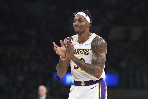 Los Angeles Lakers center Dwight Howard claps after making his free throws during an NBA basketball game against the Dallas Mavericks Sunday, Dec. 29, 2019, in Los Angeles. (AP Photo/Michael Owen Baker)