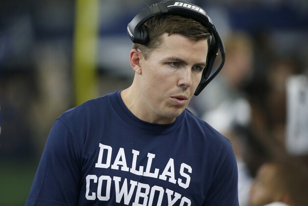 Dallas Cowboys offensive coordinator Kellen Moore talks with players on the sideline in the second half of a NFL football game against the New York Giants in Arlington, Texas, Sunday, Sept. 8, 2019. (AP Photo/Ron Jenkins)
