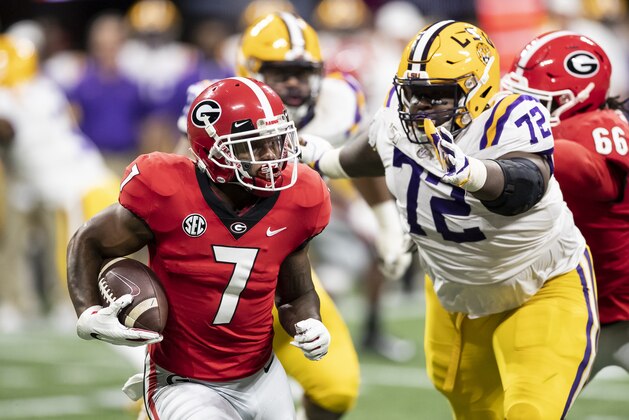 ATLANTA, GA - DECEMBER 07: D'Andre Swift #7 of the Georgia Bulldogs runs with the ball as Tyler Shelvin #72 of the LSU Tigers attempts to tackle him during a game between Georgia Bulldogs and LSU Tigers at Mercedes Benz Stadium on December 7, 2019 in Atlanta, Georgia. (Photo by Steve Limentani/ISI Photos/Getty Images)
