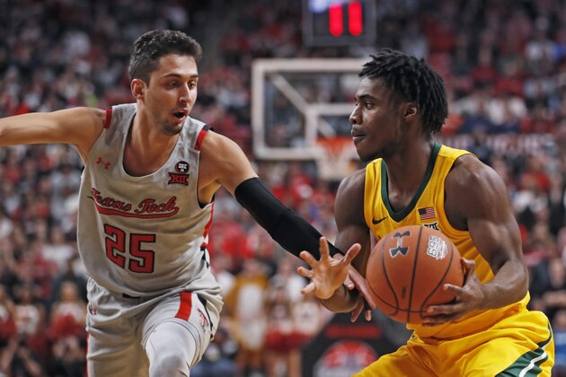 Texas Tech's Davide Moretti (25) tries to steal the ball from Baylor's Davion Mitchell during the first half of an NCAA college basketball game Tuesday, Jan. 7, 2020, in Lubbock, Texas. (AP Photo/Brad Tollefson) Texas Tech's Davide Moretti (25) tries to steal the ball from Baylor's Davion Mitchell during the first half of an NCAA college basketball game Tuesday, Jan. 7, 2020, in Lubbock, Texas. (AP Photo/Brad Tollefson)