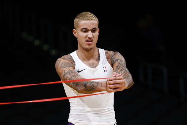 Los Angeles Lakers' Kyle Kuzma (0) warms up prior to an NBA basketball game against the Phoenix Suns, Wednesday, Jan. 1, 2020, in Los Angeles. (AP Photo/Ringo H.W. Chiu)