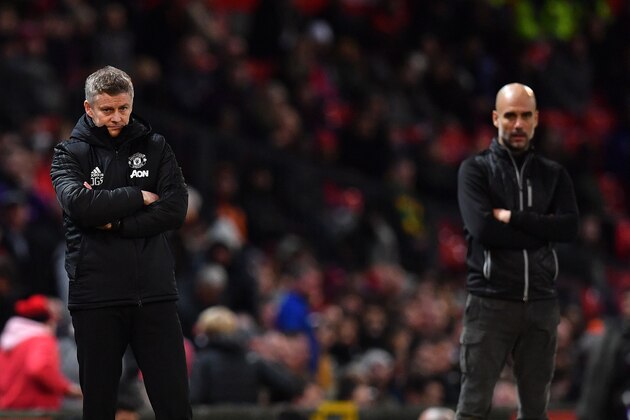 Manchester United's Norwegian manager Ole Gunnar Solskjaer (L) and Manchester City's Spanish manager Pep Guardiola react during the English League Cup semi-final first leg football match between Manchester United and Manchester City at Old Trafford in Manchester, north west England on January 7, 2020. - Manchester City won the match 3-1. (Photo by Paul ELLIS / AFP) / RESTRICTED TO EDITORIAL USE. No use with unauthorized audio, video, data, fixture lists, club/league logos or 'live' services. Online in-match use limited to 75 images, no video emulation. No use in betting, games or single club/league/player publications. /  (Photo by PAUL ELLIS/AFP via Getty Images)