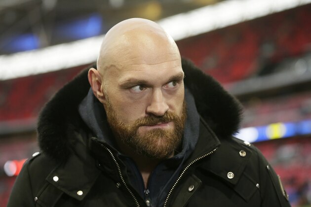 Boxer Tyson Fury is shown before an NFL football game between the Los Angeles Rams and the Cincinnati Bengals, Sunday, Oct. 27, 2019, at Wembley Stadium in London. (AP Photo/Tim Ireland) Boxer Tyson Fury is shown before an NFL football game between the Los Angeles Rams and the Cincinnati Bengals, Sunday, Oct. 27, 2019, at Wembley Stadium in London. (AP Photo/Tim Ireland)
