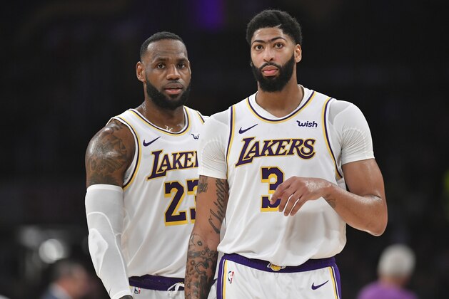 LOS ANGELES, CA - JANUARY 01: LeBron James #23 and Anthony Davis #3 of the Los Angeles Lakers while playing the Phoenix Suns at Staples Center on January 1, 2020 in Los Angeles, California. NOTE TO USER: User expressly acknowledges and agrees that, by downloading and/or using this photograph, user is consenting to the terms and conditions of the Getty Images License Agreement. Lakers won 117 to 107. (Photo by John McCoy/Getty Images)