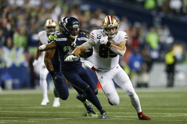 SEATTLE, WASHINGTON - DECEMBER 29: Tight end George Kittle #85 of the San Francisco 49ers runs the ball against cornerback Shaquill Griffin #26 of the Seattle Seahawks during the first half of the game at CenturyLink Field on December 29, 2019 in Seattle, Washington. (Photo by Otto Greule Jr/Getty Images)