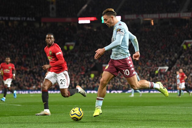 MANCHESTER, ENGLAND - DECEMBER 01: Jack Grealish of Aston Villa controls the ball as Aaron Wan-Bissaka of Manchester United looks on during the Premier League match between Manchester United and Aston Villa at Old Trafford on December 01, 2019 in Manchester, United Kingdom. (Photo by Stu Forster/Getty Images) MANCHESTER, ENGLAND - DECEMBER 01: Jack Grealish of Aston Villa controls the ball as Aaron Wan-Bissaka of Manchester United looks on during the Premier League match between Manchester United and Aston Villa at Old Trafford on December 01, 2019 in Manchester, United Kingdom. (Photo by Stu Forster/Getty Images)