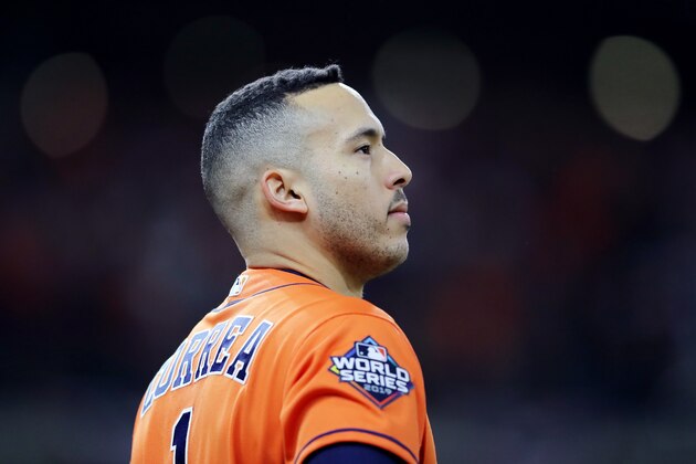 HOUSTON, TEXAS - OCTOBER 30:  Carlos Correa #1 of the Houston Astros reacts after hitting an RBI single against the Washington Nationals during the fifth inning in Game Seven of the 2019 World Series at Minute Maid Park on October 30, 2019 in Houston, Texas. (Photo by Elsa/Getty Images)