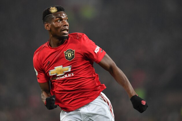 Manchester United's French midfielder Paul Pogba makes a run during the English Premier League football match between Manchester United and Newcastle United at Old Trafford in Manchester, north west England, on December 26, 2019. (Photo by Paul ELLIS / AFP) / RESTRICTED TO EDITORIAL USE. No use with unauthorized audio, video, data, fixture lists, club/league logos or 'live' services. Online in-match use limited to 120 images. An additional 40 images may be used in extra time. No video emulation. Social media in-match use limited to 120 images. An additional 40 images may be used in extra time. No use in betting publications, games or single club/league/player publications. /  (Photo by PAUL ELLIS/AFP via Getty Images)