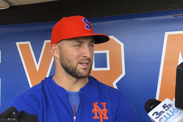 Syracuse Mets' Tim Tebow speaks with reporters prior to a minor league baseball game, Thursday, May 16, 2019 in Syracuse, N.Y. The former Heisman Trophy-winner and NFL quarterback is struggling with the Syracuse Mets but has begun to come alive at the plate with hits in five of the last six games. (AP Photo/John Kekis)