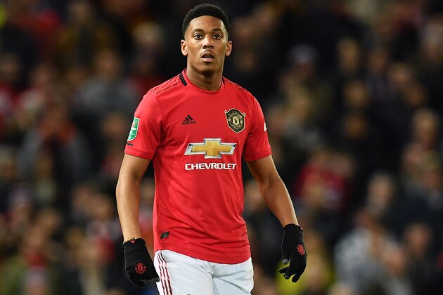 Manchester United's French striker Anthony Martial reacts during the English League Cup semi-final first leg football match between Manchester United and Manchester City at Old Trafford in Manchester, north west England on January 7, 2020. - Manchester City won the match 3-1. (Photo by Paul ELLIS / AFP) / RESTRICTED TO EDITORIAL USE. No use with unauthorized audio, video, data, fixture lists, club/league logos or 'live' services. Online in-match use limited to 75 images, no video emulation. No use in betting, games or single club/league/player publications. /  (Photo by PAUL ELLIS/AFP via Getty Images)