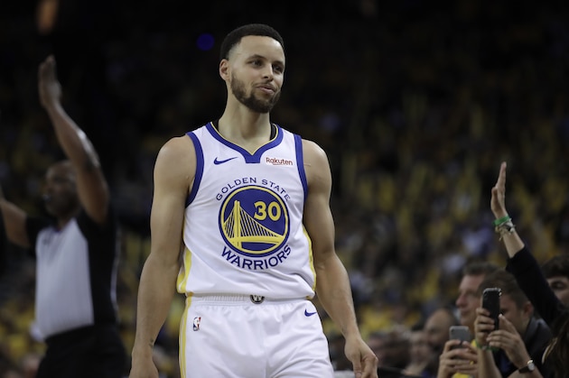 Golden State Warriors' Stephen Curry looks to the Los Angeles Clippers bench after scoring against them during the second half in Game 1 of a first-round NBA basketball playoff series Saturday, April 13, 2019, in Oakland, Calif. (AP Photo/Ben Margot)