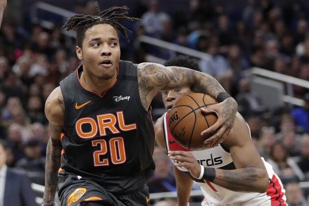 Orlando Magic's Markelle Fultz (20) passes the ball as he gets in front of Washington Wizards guard Admiral Schofield during the second half of an NBA basketball game Wednesday, Jan. 8, 2020, in Orlando, Fla. (AP Photo/John Raoux) Orlando Magic's Markelle Fultz (20) passes the ball as he gets in front of Washington Wizards guard Admiral Schofield during the second half of an NBA basketball game Wednesday, Jan. 8, 2020, in Orlando, Fla. (AP Photo/John Raoux)