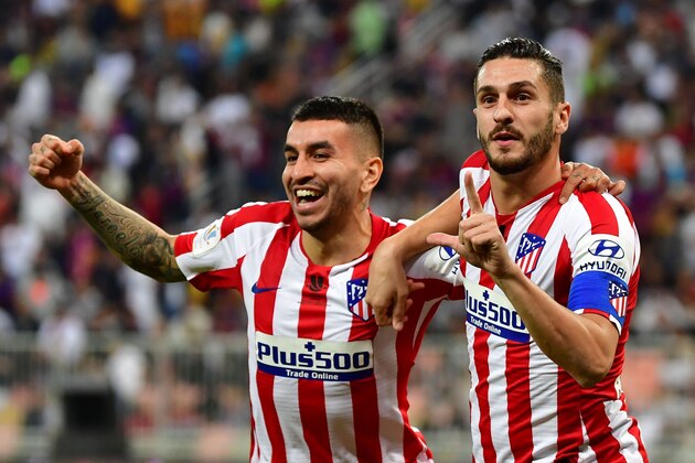 Atletico Madrid's Spanish midfielder Koke (R) celebrates his goal with Atletico Madrid's Argentine forward Angel Correa during the Spanish Super Cup semi final between Barcelona and Atletico Madrid on January 9, 2020, at the King Abdullah Sport City in the Saudi Arabian port city of Jeddah. - The winner will face Real Madrid in the final on January 12. (Photo by Giuseppe CACACE / AFP) (Photo by GIUSEPPE CACACE/AFP via Getty Images)