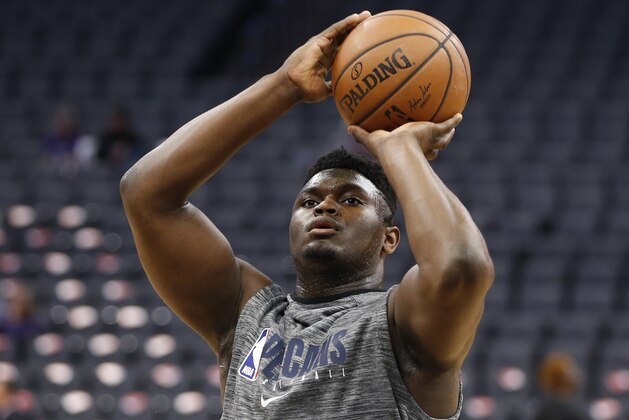 In this Saturday, Jan, 4, 2020, photo, New Orleans Pelicans rookie Zion Williamson shoots during a workout before the Pelicans played the Sacramento Kings in an NBA basketball game in Sacramento, Calif. Williamson, who is recovering from a knee injury, has now participated in full-court and five-on-five drills as the top overall draft choice moves closer to making his league debut. (AP Photo/Rich Pedroncelli)