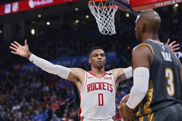 Houston Rockets guard Russell Westbrook (0) defends as Oklahoma City Thunder guard Chris Paul (3) looks to inbound the ball during the ball during the first half of an NBA basketball game Thursday, Jan. 9, 2020, in Oklahoma City. (AP Photo/Sue Ogrocki)