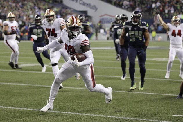 San Francisco 49ers wide receiver Deebo Samuel scores on a 30-yard run against the Seattle Seahawks during the first half of an NFL football game, Sunday, Dec. 29, 2019, in Seattle. (AP Photo/Stephen Brashear) San Francisco 49ers wide receiver Deebo Samuel scores on a 30-yard run against the Seattle Seahawks during the first half of an NFL football game, Sunday, Dec. 29, 2019, in Seattle. (AP Photo/Stephen Brashear)