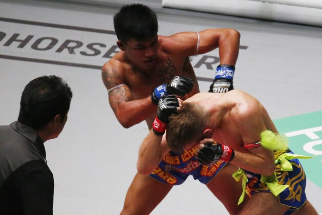 Challenger Rodtang Jitmuangnon, top, of Thailand delivers a barrage of strikes to reigning ONE Flyweight Muay Thai World Champion Jonathan Haggerty, right, of the United Kingdom during their ONE Flyweight World Championship Mixed Martial Arts title fight dubbed 'Dawn of Heroes' Friday, Aug. 2, 2019 at the Mall of Asia Arena in suburban Pasay city south of Manila, Philippines. Rodtang dethroned Haggerty via a unanimous decision. (AP Photo/Bullit Marquez) Challenger Rodtang Jitmuangnon, top, of Thailand delivers a barrage of strikes to reigning ONE Flyweight Muay Thai World Champion Jonathan Haggerty, right, of the United Kingdom during their ONE Flyweight World Championship Mixed Martial Arts title fight dubbed 'Dawn of Heroes' Friday, Aug. 2, 2019 at the Mall of Asia Arena in suburban Pasay city south of Manila, Philippines. Rodtang dethroned Haggerty via a unanimous decision. (AP Photo/Bullit Marquez)