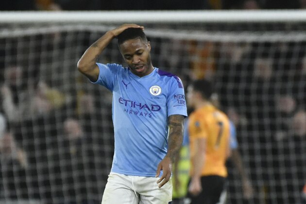 Manchester City's Raheem Sterling touches his head after Wolverhampton Wanderers' Matt Doherty scored his side's third goal, during the English Premier League soccer match between Wolverhampton Wanderers and Manchester City at the Molineux Stadium in Wolverhampton, England, Friday, Dec. 27, 2019. (AP Photo/Rui Vieira)