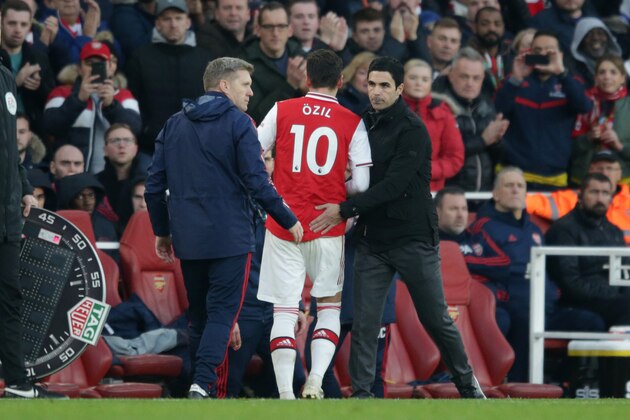 LONDON, ENGLAND - DECEMBER 29: Mikel Arteta with Mesut Ozil of Arsenal after he is subbed during the Premier League match between Arsenal FC and Chelsea FC at Emirates Stadium on December 29, 2019 in London, United Kingdom. (Photo by Robin Jones/Getty Images)