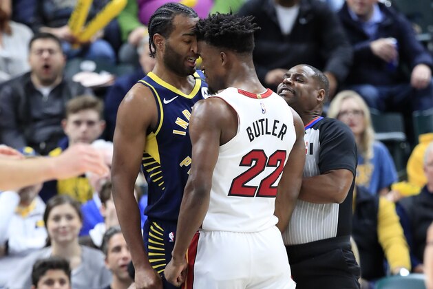 INDIANAPOLIS, INDIANA - JANUARY 08:  Jimmy Butler #22 of the Miami Heat and T.J. Warren #1 of  the Indiana Pacers get involved in an argument during the game at Bankers Life Fieldhouse on January 08, 2020 in Indianapolis, Indiana.    NOTE TO USER: User expressly acknowledges and agrees that, by downloading and or using this photograph, User is consenting to the terms and conditions of the Getty Images License Agreement. (Photo by Andy Lyons/Getty Images)