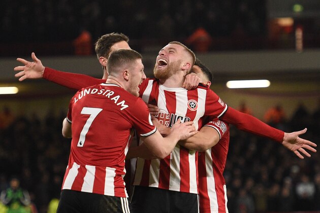 Sheffield United's English-born Scottish striker Oliver McBurnie celebrates scoring the opening goal during the English Premier League football match between Sheffield United and West Ham United at Bramall Lane in Sheffield, northern England on January 10, 2020. (Photo by Oli SCARFF / AFP) / RESTRICTED TO EDITORIAL USE. No use with unauthorized audio, video, data, fixture lists, club/league logos or 'live' services. Online in-match use limited to 120 images. An additional 40 images may be used in extra time. No video emulation. Social media in-match use limited to 120 images. An additional 40 images may be used in extra time. No use in betting publications, games or single club/league/player publications. /  (Photo by OLI SCARFF/AFP via Getty Images)
