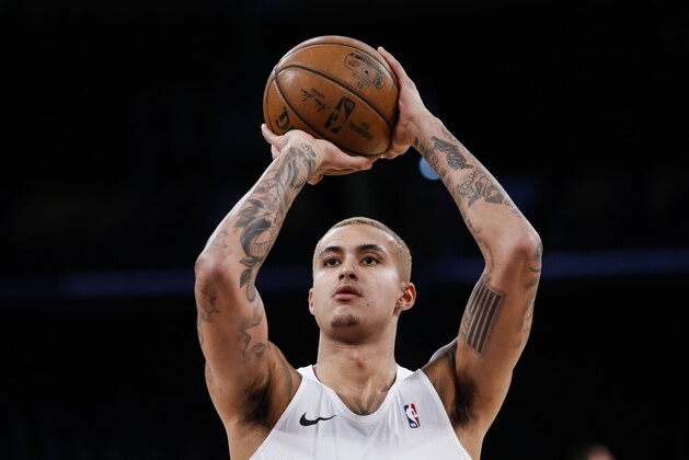 Los Angeles Lakers' Kyle Kuzma (0) warms up prior to an NBA basketball game against the Phoenix Suns, Wednesday, Jan. 1, 2020, in Los Angeles. (AP Photo/Ringo H.W. Chiu)