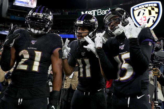 BALTIMORE, MARYLAND - DECEMBER 12: Wide receiver Seth Roberts #11 of the Baltimore Ravens and teammates running back Mark Ingram #21 and wide receiver Marquise Brown #15 celebrate Roberts' touchdown in the third quarter of the game against the New York Jets at M&T Bank Stadium on December 12, 2019 in Baltimore, Maryland. (Photo by Patrick Smith/Getty Images)