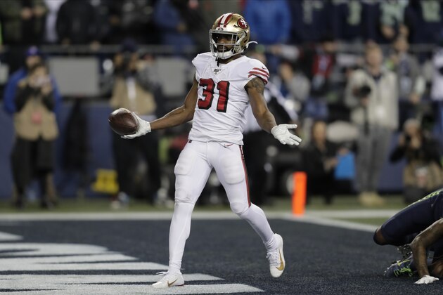 San Francisco 49ers' Raheem Mostert scores a touchdown against the Seattle Seahawks during the second half of an NFL football game, Sunday, Dec. 29, 2019, in Seattle. (AP Photo/Stephen Brashear)