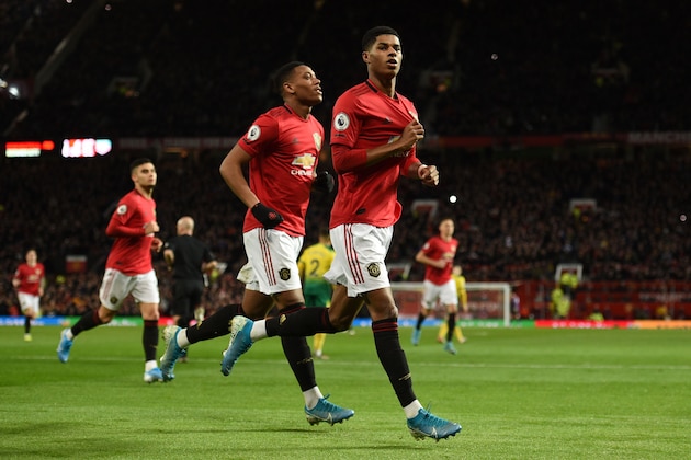 Manchester United's English striker Marcus Rashford (R) celebrates scoring their second goal during the English Premier League football match between Manchester United and Norwich City at Old Trafford in Manchester, north west England, on January 11, 2020. (Photo by Oli SCARFF / AFP) / RESTRICTED TO EDITORIAL USE. No use with unauthorized audio, video, data, fixture lists, club/league logos or 'live' services. Online in-match use limited to 120 images. An additional 40 images may be used in extra time. No video emulation. Social media in-match use limited to 120 images. An additional 40 images may be used in extra time. No use in betting publications, games or single club/league/player publications. /  (Photo by OLI SCARFF/AFP via Getty Images)