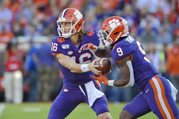 Clemson's Trevor Lawrence, left, hands the ball off to Travis Etienne during the first half of an NCAA college football game against Wofford, Saturday, Nov. 2, 2019, in Clemson, S.C. (AP Photo/Richard Shiro) Clemson's Trevor Lawrence, left, hands the ball off to Travis Etienne during the first half of an NCAA college football game against Wofford, Saturday, Nov. 2, 2019, in Clemson, S.C. (AP Photo/Richard Shiro)