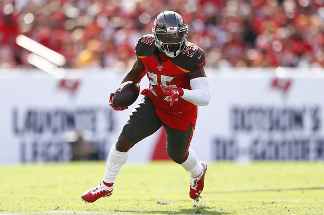 TAMPA, FLORIDA - DECEMBER 29:  Peyton Barber #25 of the Tampa Bay Buccaneers runs with the ball against the Atlanta Falcons during the first half at Raymond James Stadium on December 29, 2019 in Tampa, Florida. (Photo by Michael Reaves/Getty Images)