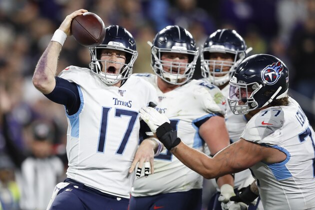 Tennessee Titans quarterback Ryan Tannehill (17) celebrates his touchdown against the Baltimore Ravens during the second half of an NFL divisional playoff football game, Saturday, Jan. 11, 2020, in Baltimore. (AP Photo/Julio Cortez)