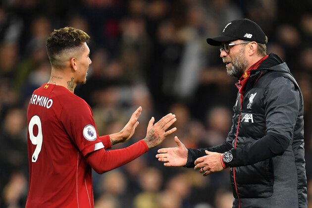 LONDON, ENGLAND - JANUARY 11: Jurgen Klopp, Manager of Liverpool embraces Roberto Firmino of Liverpool following the Premier League match between Tottenham Hotspur and Liverpool FC at Tottenham Hotspur Stadium on January 11, 2020 in London, United Kingdom. (Photo by Justin Setterfield/Getty Images)