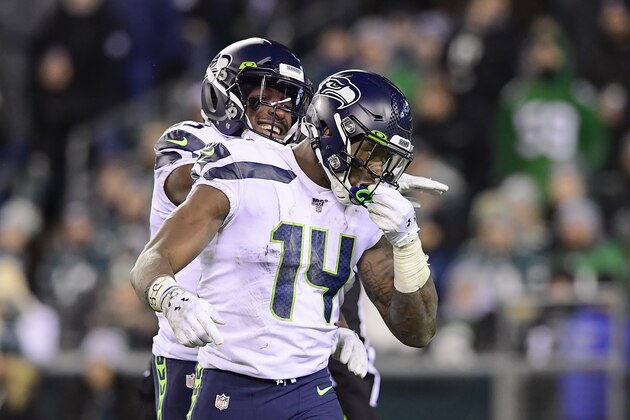 PHILADELPHIA, PENNSYLVANIA - JANUARY 05:  DK Metcalf #14 of the Seattle Seahawks is congratulated by his teammate David Moore #83 after his touchdown reception against the Philadelphia Eagles in the NFC Wild Card Playoff game at Lincoln Financial Field on January 05, 2020 in Philadelphia, Pennsylvania. (Photo by Steven Ryan/Getty Images)