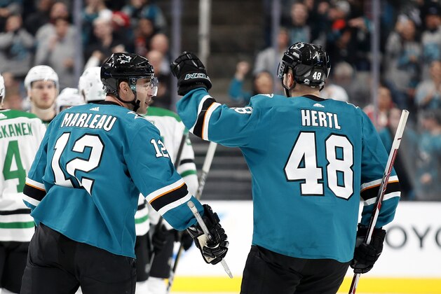 San Jose Sharks center Tomas Hertl (48) congratulates Patrick Marleau (12), who scored a goal against the Dallas Stars during the second period of an NHL hockey game in San Jose, Calif., Saturday, Jan. 11, 2020. (AP Photo/Josie Lepe)