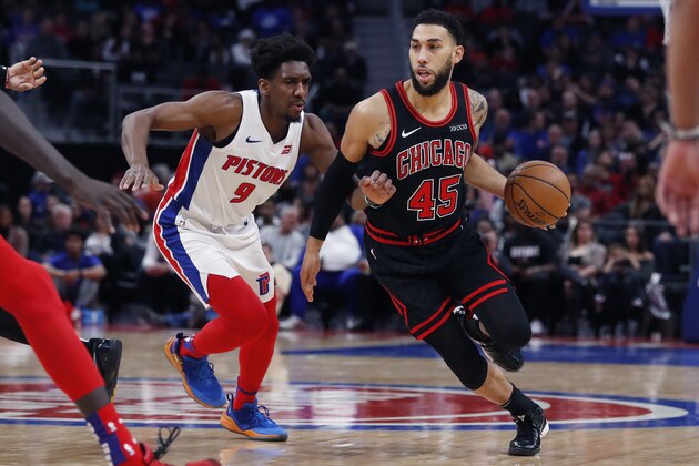 Chicago Bulls guard Denzel Valentine (45) drives as Detroit Pistons guard Langston Galloway (9) defends during the second half of an NBA basketball game, Saturday, Dec. 21, 2019, in Detroit. (AP Photo/Carlos Osorio)