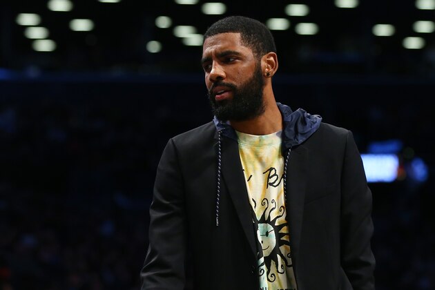 NEW YORK, NEW YORK - JANUARY 04:  Kyrie Irving #11 looks on from the bench during the game between the Brooklyn Nets and the Toronto Raptors at Barclays Center on January 04, 2020 in New York City.   Toronto Raptors defeated the Brooklyn Nets 121-102. NOTE TO USER: User expressly acknowledges and agrees that, by downloading and or using this photograph, User is consenting to the terms and conditions of the Getty Images License Agreement. Mandatory Copyright Notice: Copyright 2020 NBAE. (Photo by Mike Stobe/Getty Images)