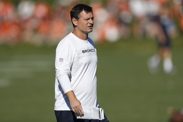 Denver Broncos offensive coordinator Rich Scangarello takes part in drills during an NFL football training camp session Monday, Aug. 5, 2019, in Englewood, Colo. (AP Photo/David Zalubowski)