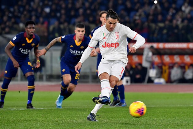 ROME, ITALY - JANUARY 12: Cristiano Ronaldo of Juventus scoring his penalty goal 0-2 ,during the Serie A match between AS Roma and Juventus at Stadio Olimpico on January 12, 2020 in Rome, Italy. (Photo by MB Media/Getty Images)