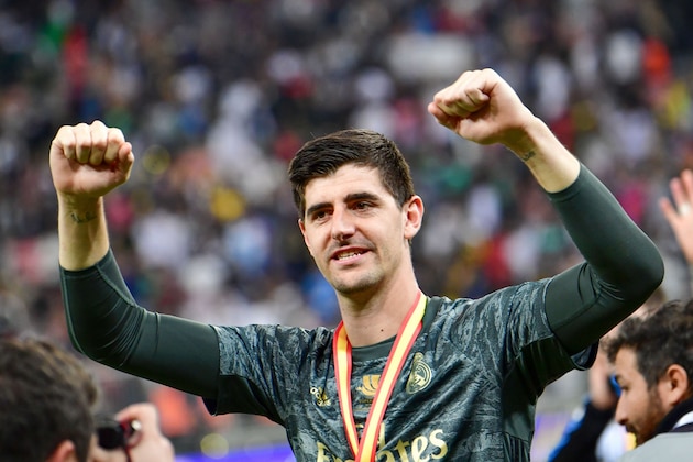 Real Madrid's Belgian goalkeeper Thibaut Courtois celebrates after winning the Spanish Super Cup final between Real Madrid and Atletico Madrid on January 12, 2020, at the King Abdullah Sports City in the Saudi Arabian port city of Jeddah. (Photo by Giuseppe CACACE / AFP) (Photo by GIUSEPPE CACACE/AFP via Getty Images) Real Madrid's Belgian goalkeeper Thibaut Courtois celebrates after winning the Spanish Super Cup final between Real Madrid and Atletico Madrid on January 12, 2020, at the King Abdullah Sports City in the Saudi Arabian port city of Jeddah. (Photo by Giuseppe CACACE / AFP) (Photo by GIUSEPPE CACACE/AFP via Getty Images)