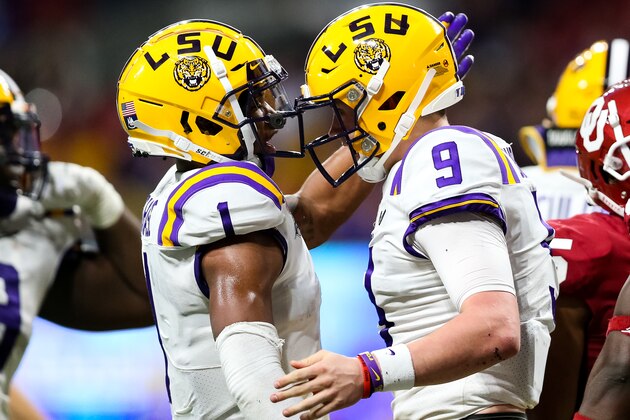 ATLANTA, GA - DECEMBER 28: Ja'Marr Chase #1 celebrates alongside Joe Burrow #9 of the LSU Tigers  during the Chick-fil-A Peach Bowl against the Oklahoma Sooners at Mercedes-Benz Stadium on December 28, 2019 in Atlanta, Georgia. (Photo by Carmen Mandato/Getty Images)