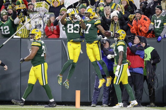 Green Bay Packers' Davante Adams celebrates his touchdown catch with Marquez Valdes-Scantling (83) during the first half of an NFL divisional playoff football game against the Seattle Seahawks Sunday, Jan. 12, 2020, in Green Bay, Wis. (AP Photo/Darron Cummings)